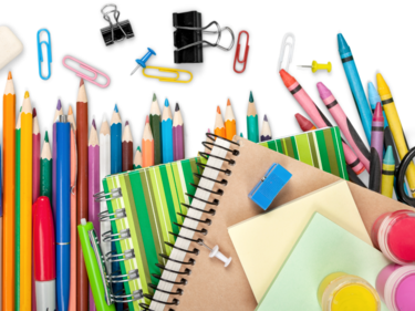 Flat lay image of pencils, paper clips, markers, scissors, notebook and other school supplies